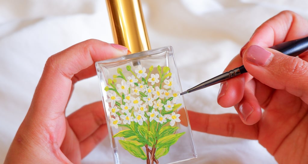 Perfume bottle painted with jasmine flowers for an NYC perfume brand by Handwritten by Belle.