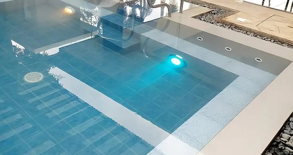 Desain kolam renang air hangat modern dengan air terjun buatan di Purwakarta.