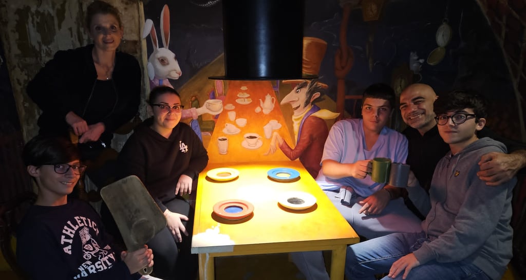 a group of people sitting around a table with a table with a table cloth