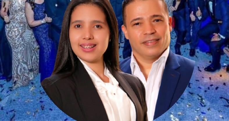 a man and woman posing for a photo with confettitti