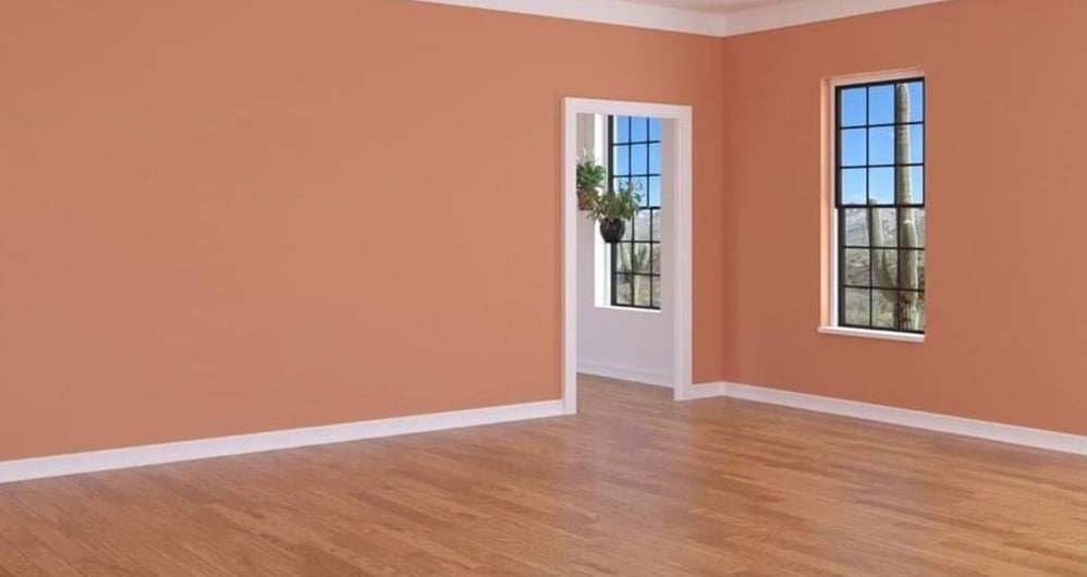 a room with wooden floor, newly painted walls, everything newly renovated.