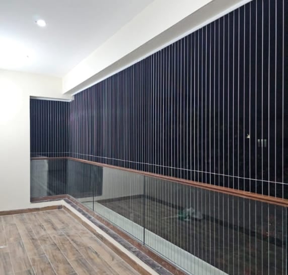 Close-up of sleek invisible grill installed on a window in Anna Nagar.