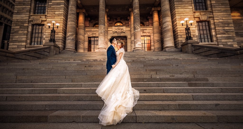a bride and groom at New Zealand Parliament Building Beehive Wellington