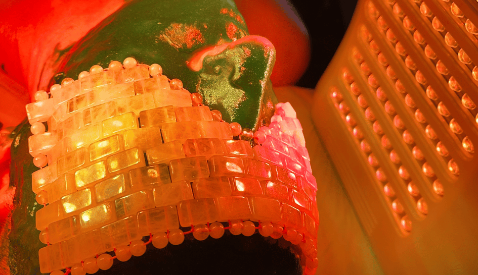 zoom in shot green spirulina jelly mask and yellow LED light skin treatment by Lux Skin Bar