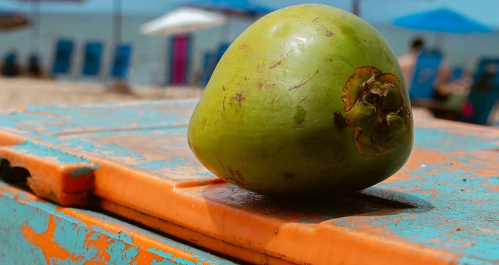 a green apple sitting on top of a table