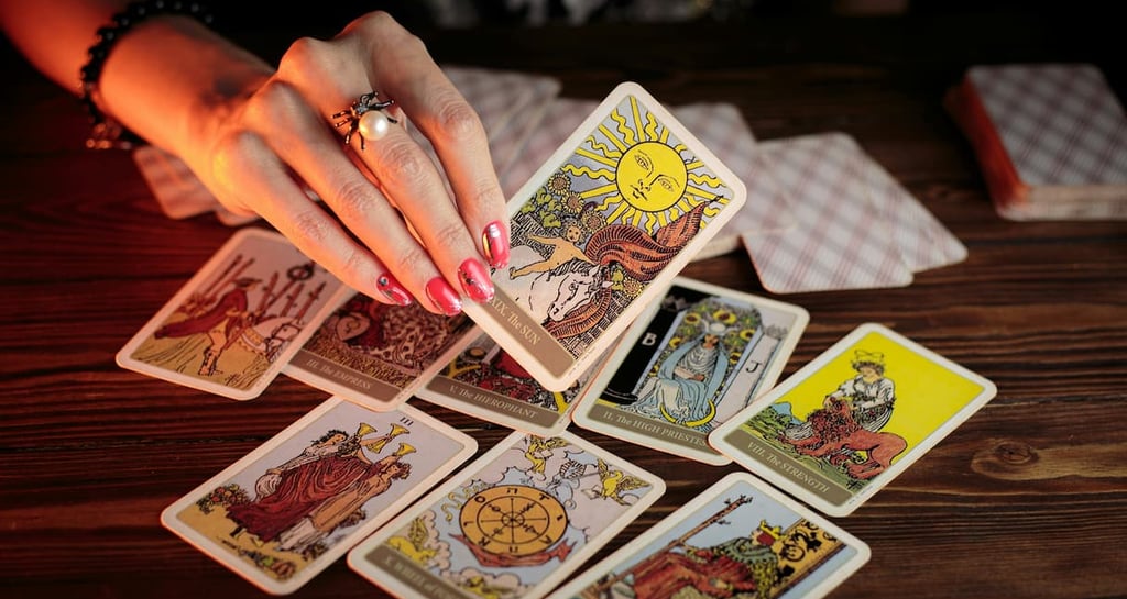 Close-up of tarot reading featuring The Sun card — guided by Amber, Queen of Wands.