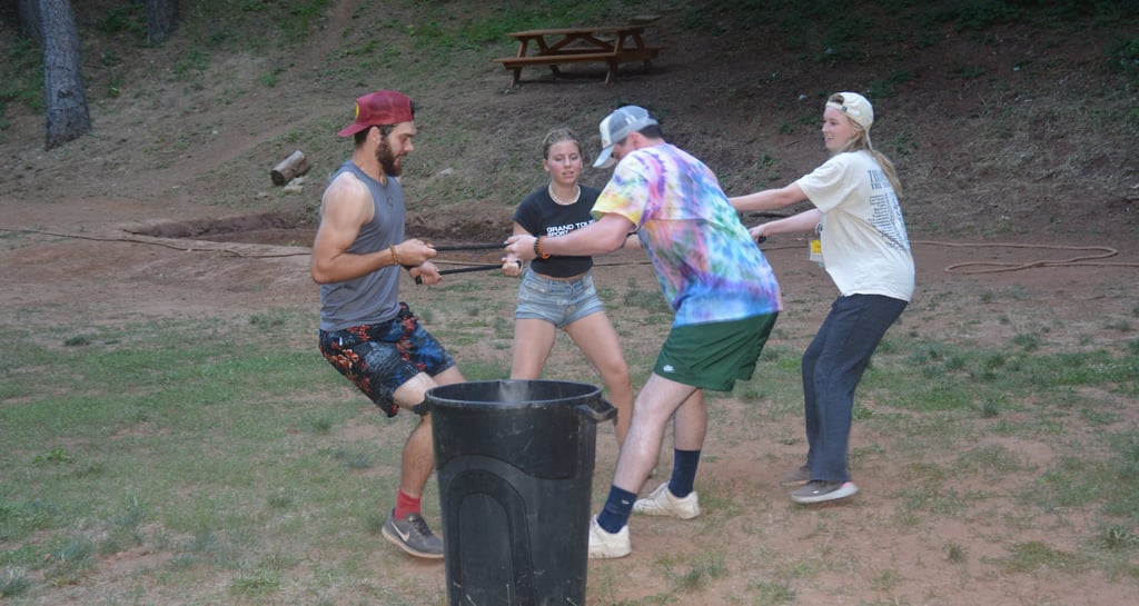 a group of people playing kajabi kan-kan