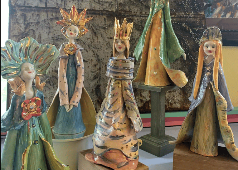 a group of ceramic figurines of three wise wise men and women