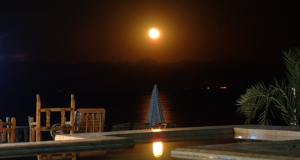 Night view of the moon on the pool at Bedouin star
