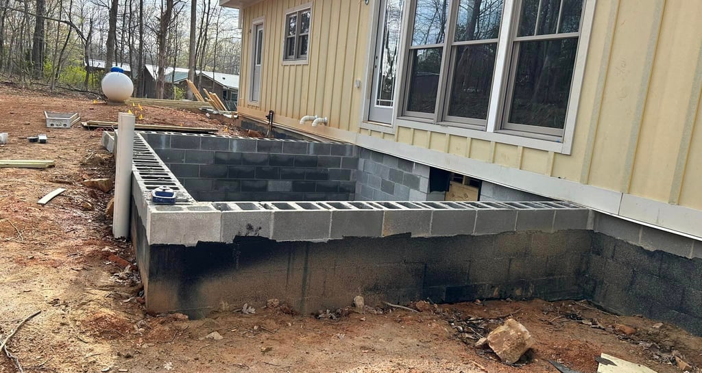 a concrete block foundation being built into a house
