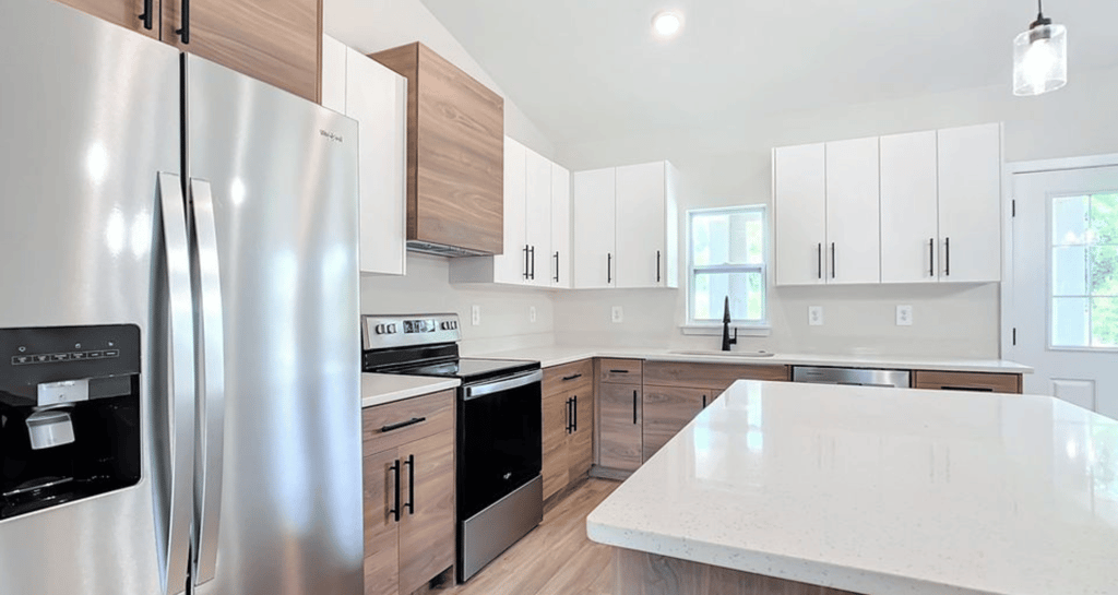 Modern kitchen remodeling in Kissimmee, FL with quartz countertops, shaker cabinets, and LED lightin