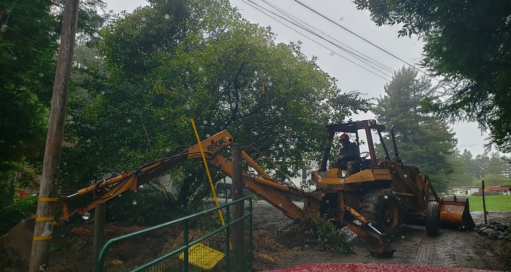 a tractor with a loader on it's back end