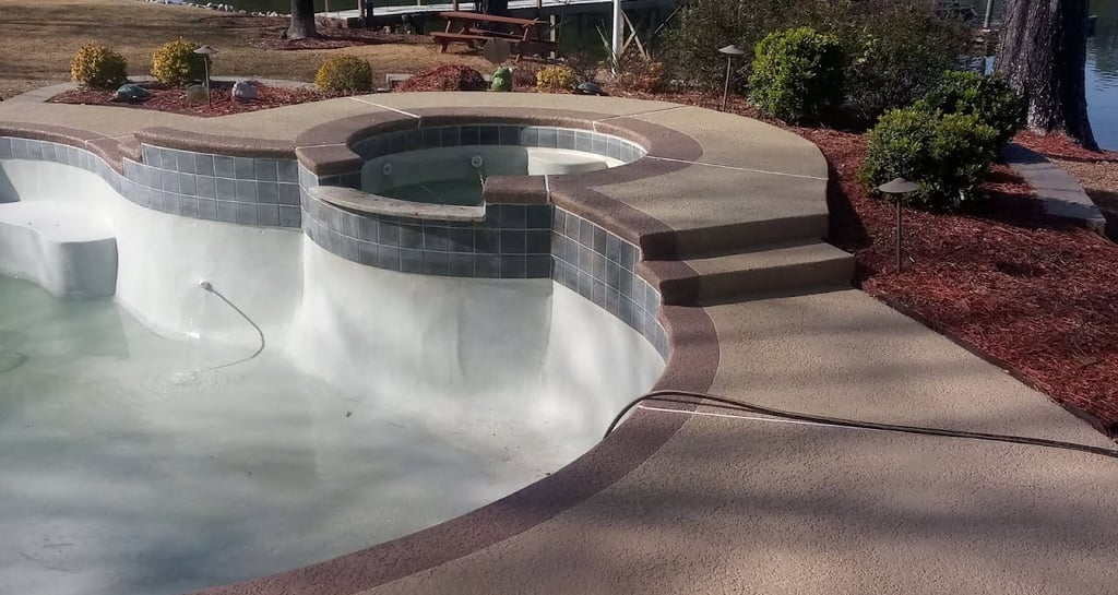 a pool with a large pool and a dock