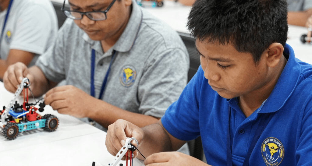 Group of professionals engaged in a technical workshop, focused and collaborative.