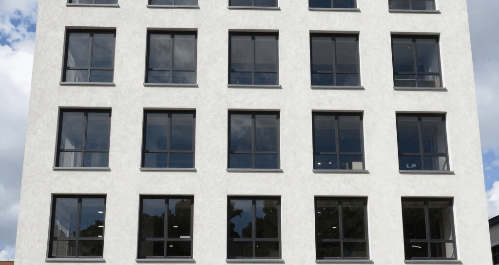 Exterior of a newly constructed commercial building with clean lines and professional signage.