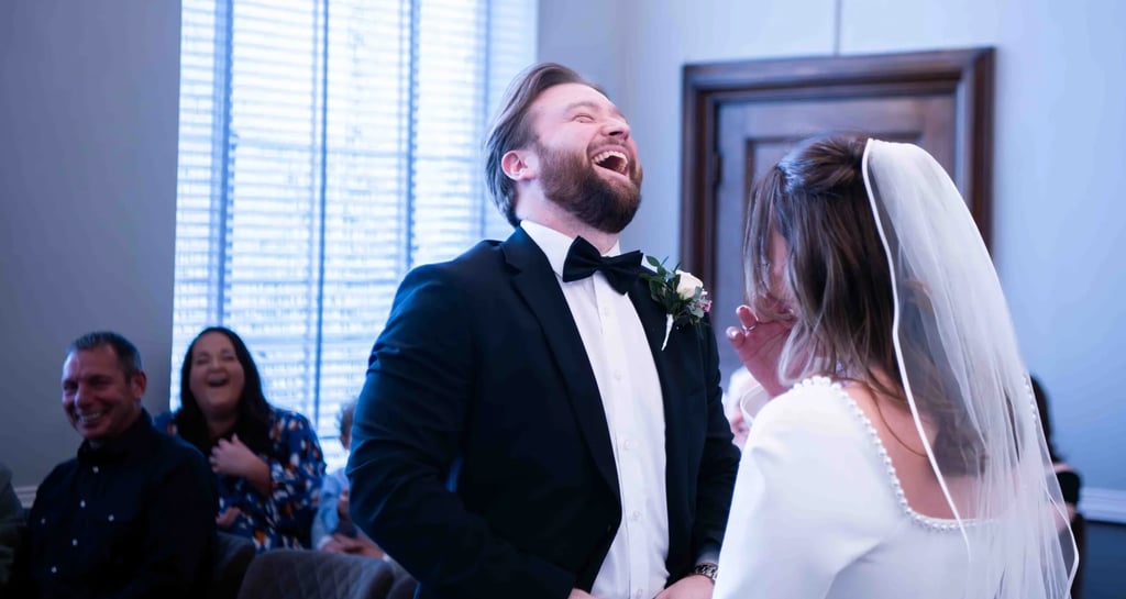 a man and woman are laughing and laughing