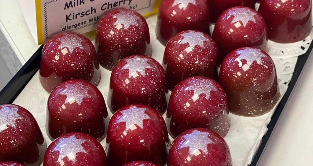 Kirsch Cherry Bon Bons, milk chocolate with alayer of cherry pate de fruit and a cherry ganache
