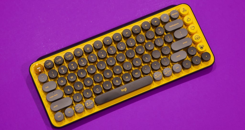 a keyboard and mouse mouse on a purple background