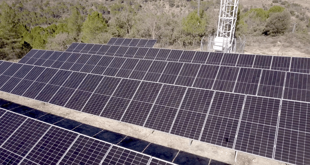 solar panels with a tower in the background