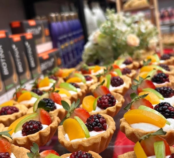 a variety of desserts on display in a store