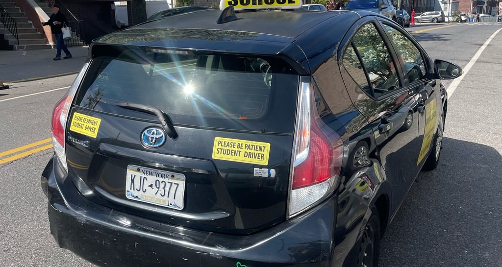 a taxi cab cab cab with a driver's license plate
