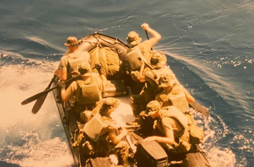 Marine Raiders debarking shipt with paddles out