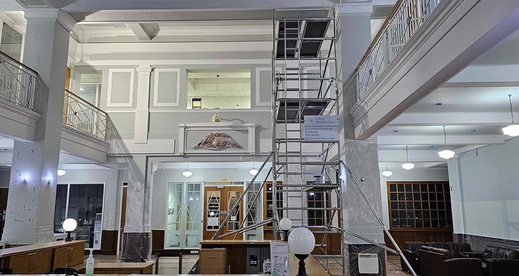 Interior commercial painting project in Croydon with scaffolding, carried out by Pure Perfection