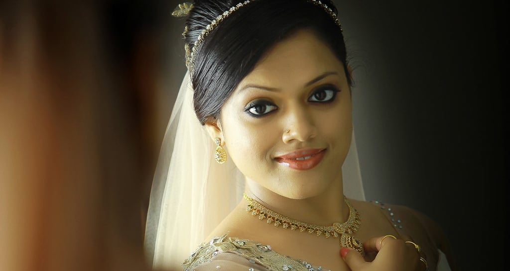 Christian bride on wedding gown