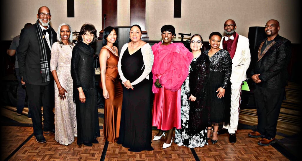 a group of people standing in front of a stage for GFW MLK Jr. Community Event