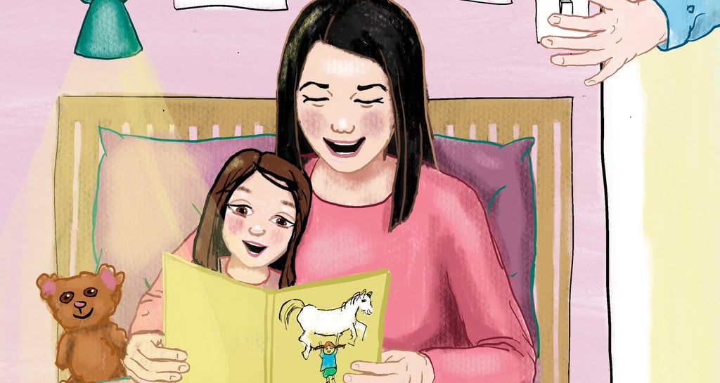 Mother and daughter reading a bedtime storybook together in bed with a teddy bear.