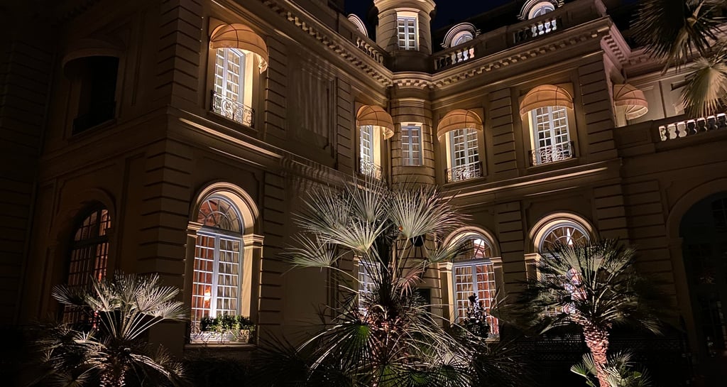 a large building with a lot of windows and lights