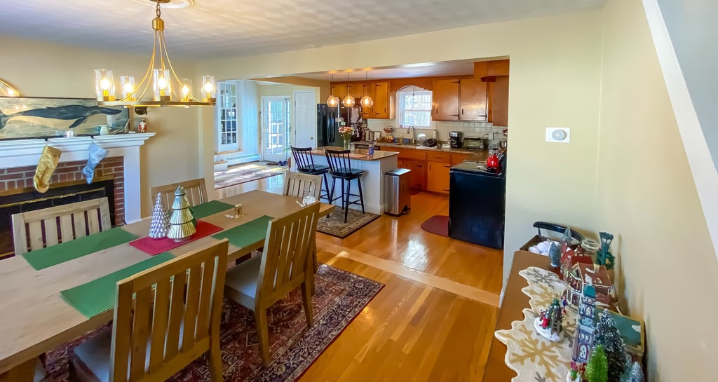 a dining room with a fireplace and a fireplace