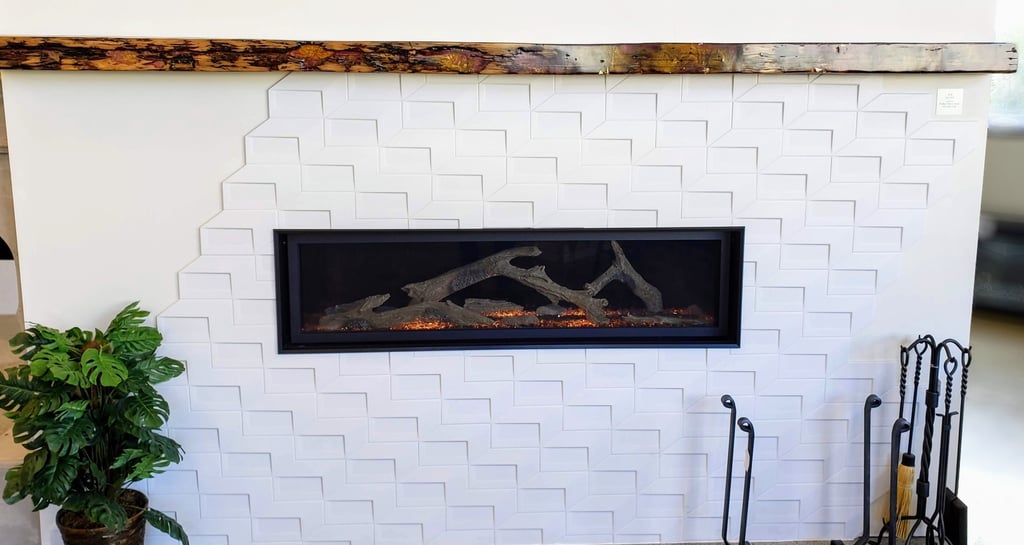 Reclaimed wood and epoxy mantle with wormwood pattern.  Modern gas fireplace with geometric tile work surround. El Paso, CO.