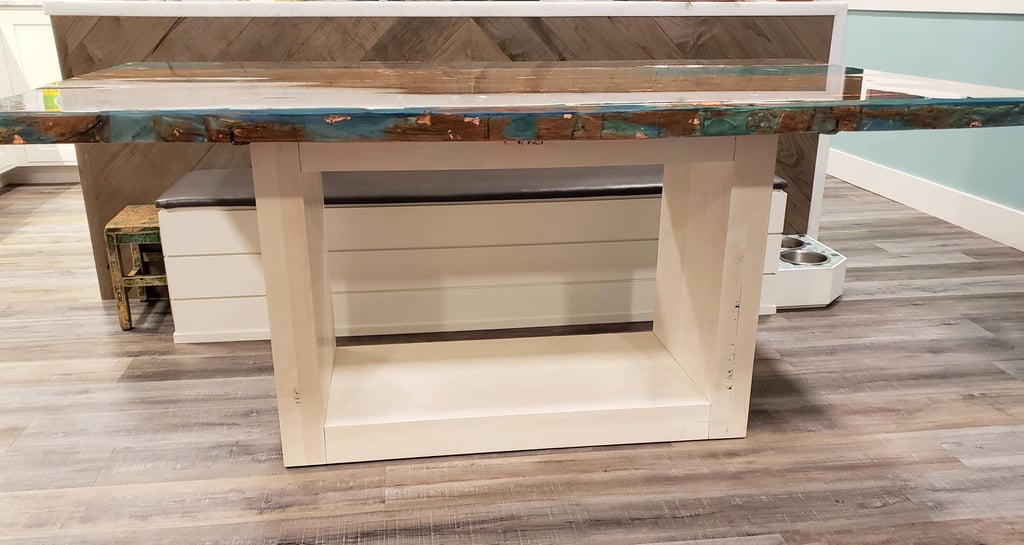 custom dinner table with colored epoxy with gold flecks and reclaimed wood with a maple wood base. Colorado Springs Kitchen.