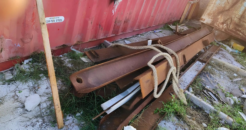 a pile of metal pipes and pipes in a yard scrap by swastik exim team