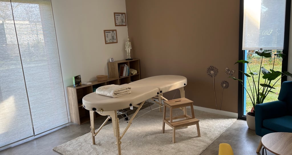 a massage table with a massage table and chairs