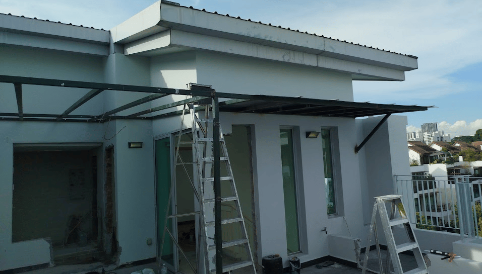 Professional installation of a metal frame awning on a residential rooftop terrace.