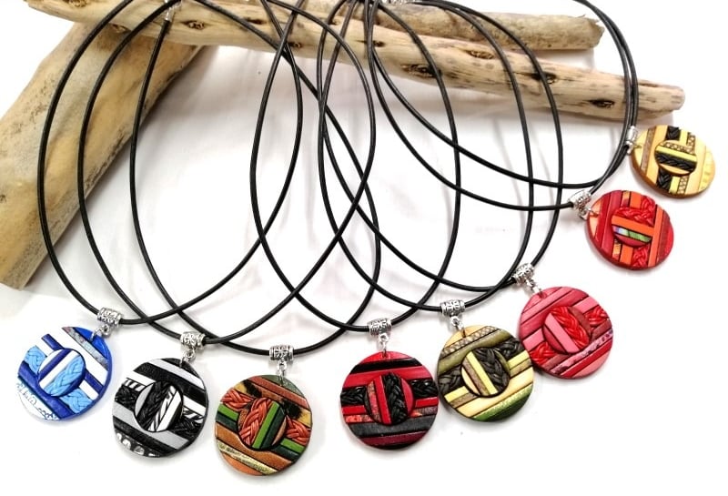 a bunch of necklaces with different designs