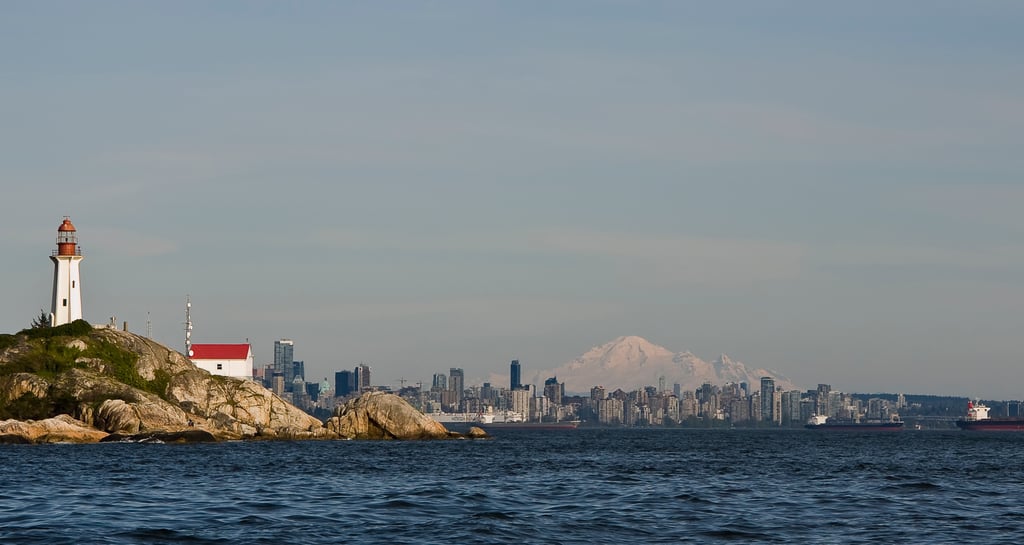 Point Atkinson Lighthouse overlooking the Vancouver skyline and Mount Baker on a clear day.