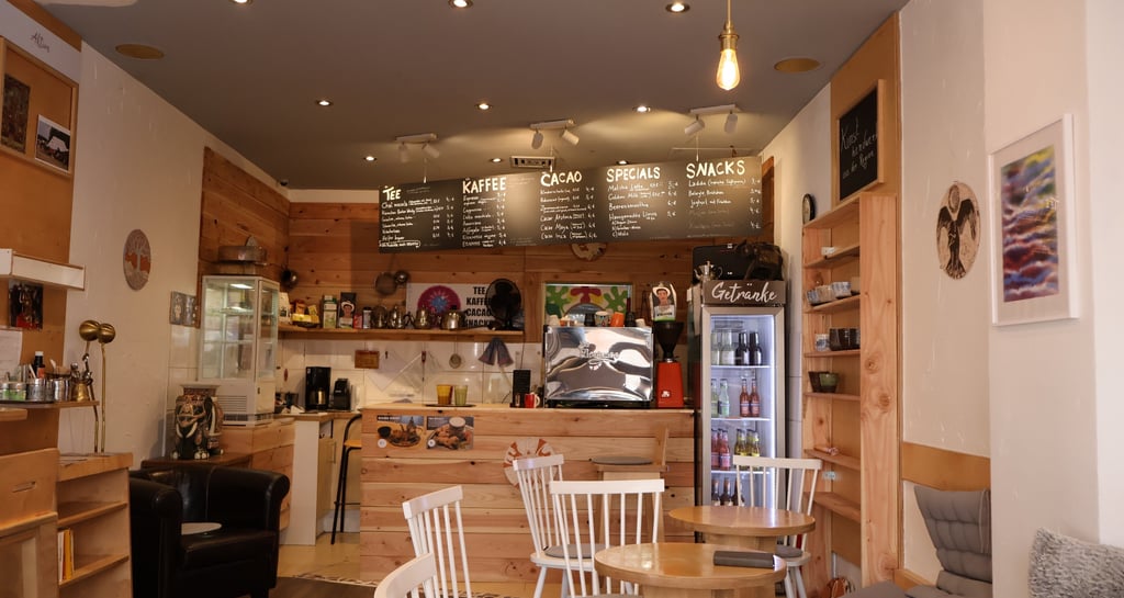 a cafe with a small table and chairs