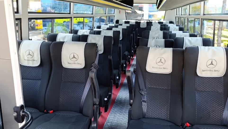 Interior of a luxury Mercedes-Benz bus available for hire for short & long distance trips