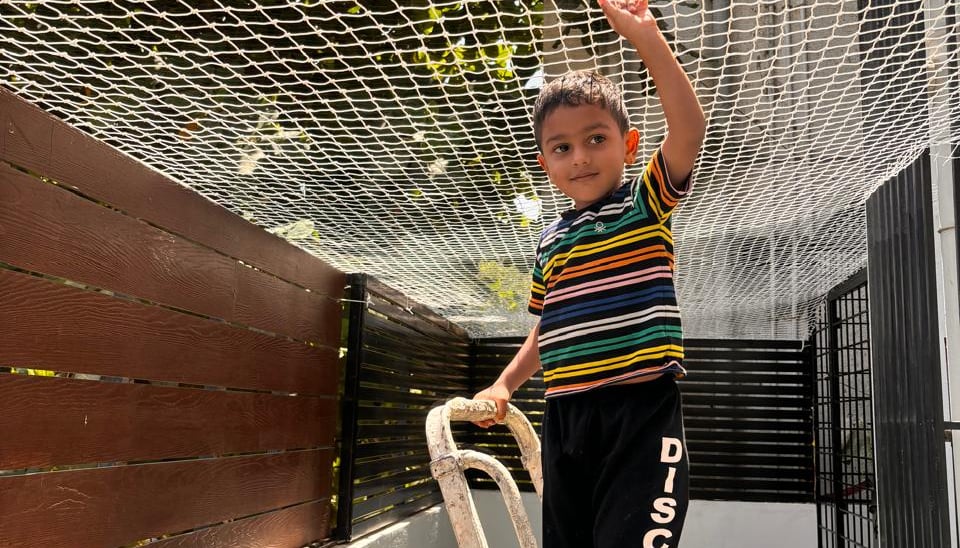 Close-up of a sturdy children safety net securely installed on a balcony in a Bengaluru apartment.