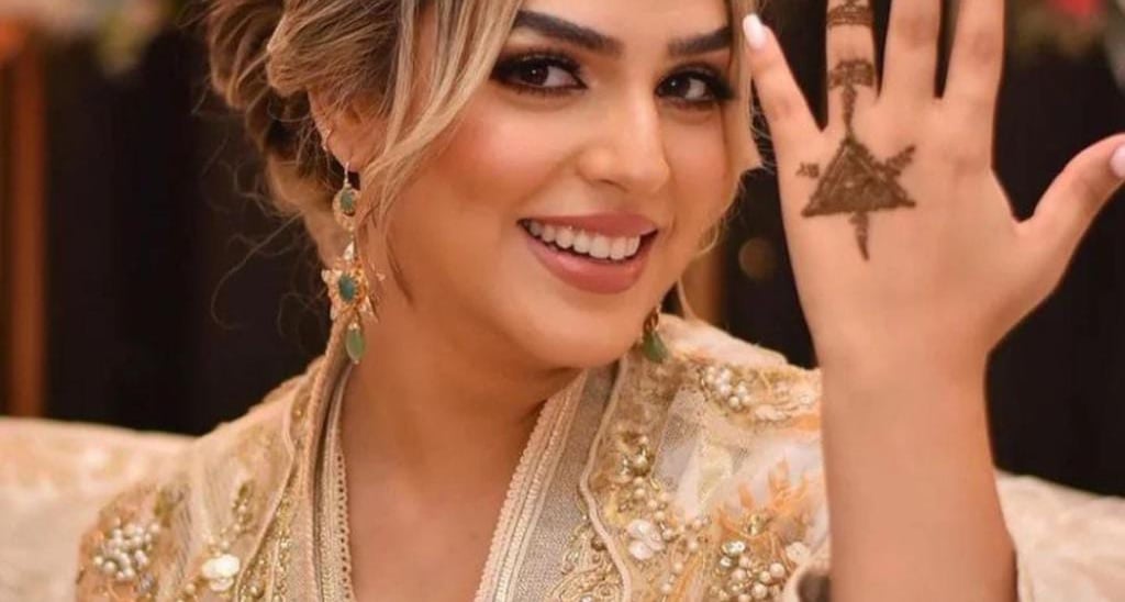 a woman in a gold crown tiable and a crown tiable