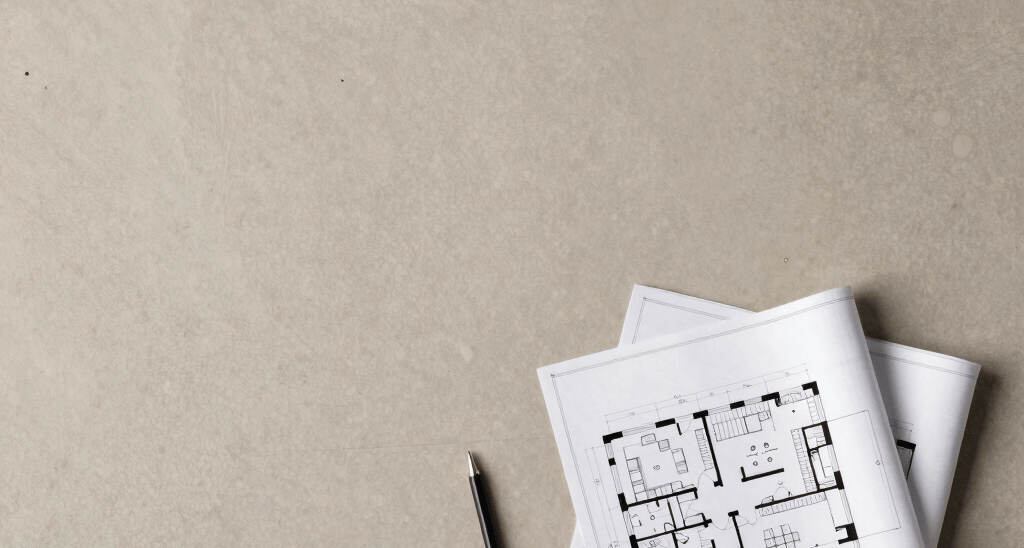 A sleek, modern office lobby bathed in soft taupe and beige tones with bold black accents.