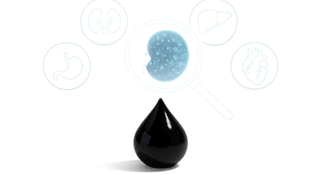 A clean clinical background with a large white surface. A single black Shilajit resin drop.