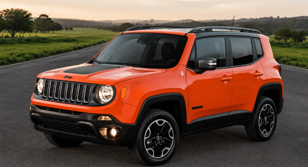 Jeep Renegade Diesel 4x4 laranja estacionado em uma estrada rural