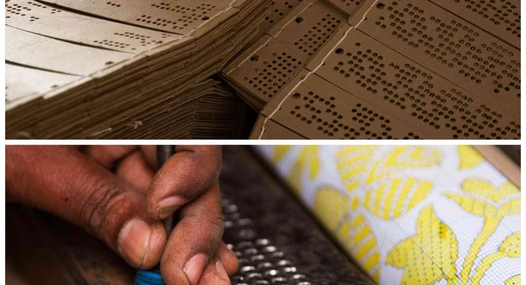 a person holding a tool to design cards in their hand