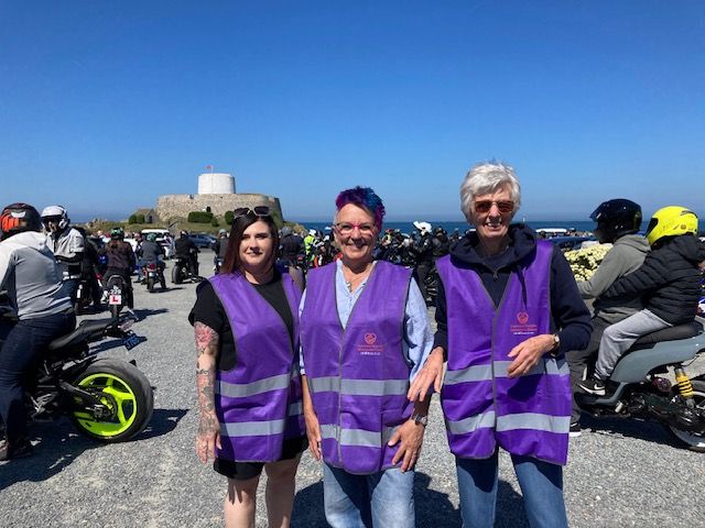 GSAG members standing in front of a group of motorcycles