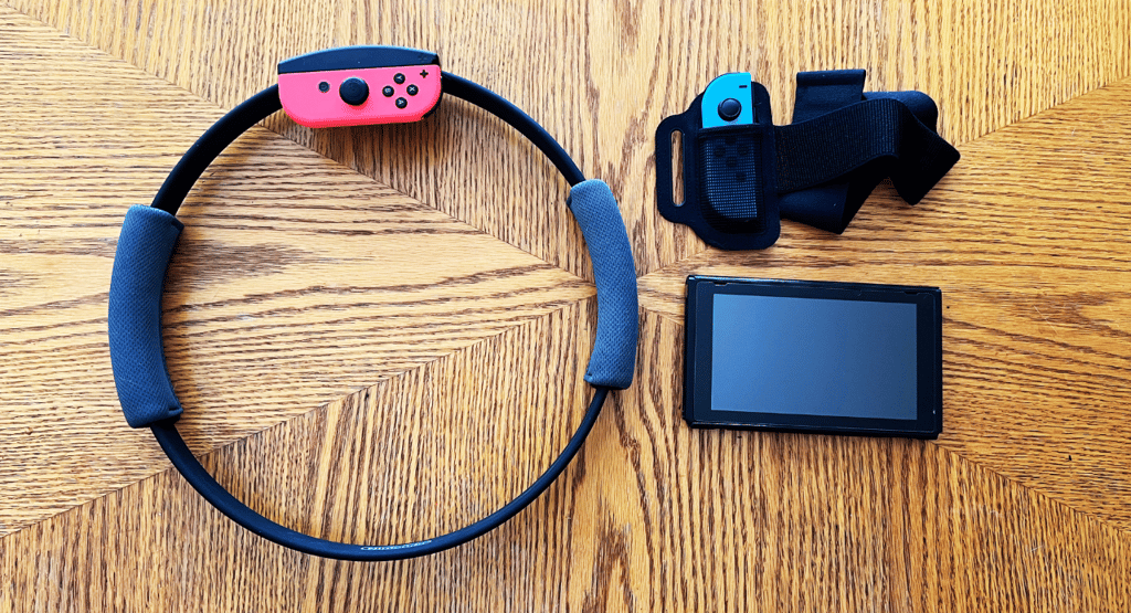 a nintendo wii game controller and Ring Fit Adventure