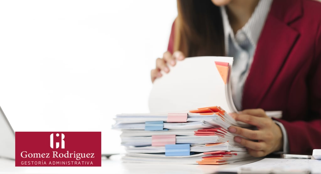 a woman in a red jacket is holding a folder and a laptop